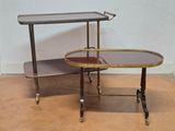 pair of brass and glass side tables on casteors with wheels
