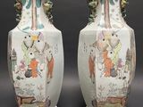 two vases that have been decorated with animals on them