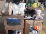 a pile of boxes with stuffed animals on top of them