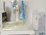a toothbrush, toothpaste, toothpaste and other items sitting on a shelf