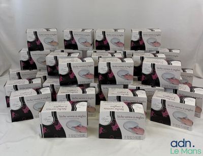several boxes of cupcakes sitting on a table with a white background