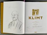 an open book with a drawing of a man in a suit and tie