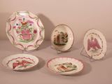five plates with different designs on them on a table