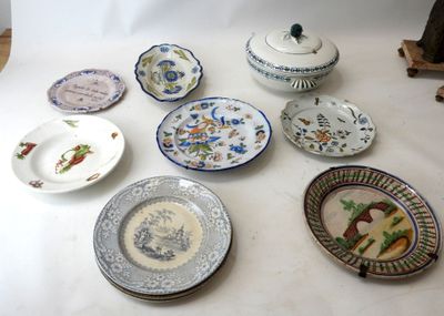 a lot of plates and bowls on the table