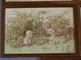 three framed pictures of a baby and a horse in a field