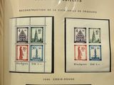 a book with a picture of a building and two stamps on it