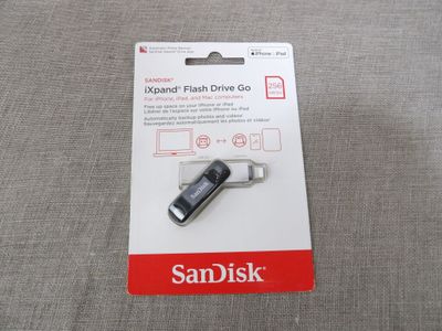an image of a usb drive with a card attached to it