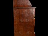 an old wooden cabinet with a drawer on top of it on a black background