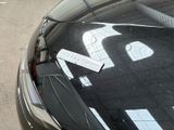 a sticker on the hood of a car with a number 24 on it