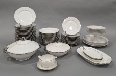 a lot of plates and bowls on the table