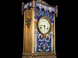 a clock that is sitting on a stand on a black background