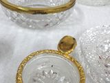 a lot of glass dishes and bowls on the table