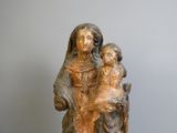 a statue of a woman holding a child on her lap