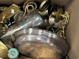 a box full of silver and gold items in it