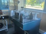 a coffee machine that is sitting on a table in front of a window