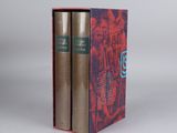 the two books are in a red box on a white surface