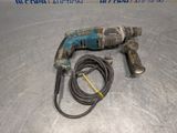 a drill that is sitting on a metal surface