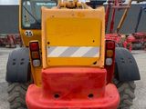 an image of a construction vehicle parked in a parking lot