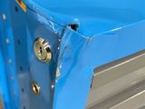 a close up of a blue metal cabinet with screws