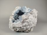 a small piece of rock with a small piece of ice on top of it