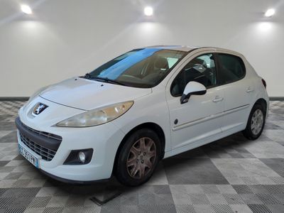 the small white car is parked in the garage on a checkered floor