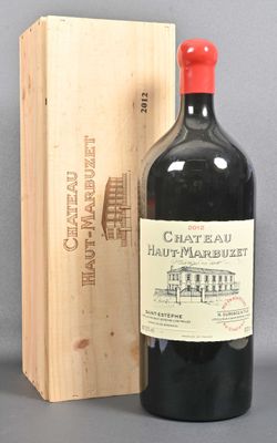 a bottle of wine sitting next to a wooden box