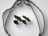an image of a necklace and two pairs of earrings on a chain