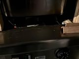 a tv that is sitting on top of a stove