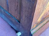 a close up of a wooden door with a metal latch