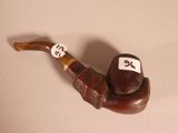 a pipe with a sticker on it sitting on a table
