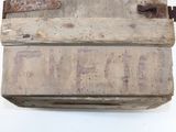 an old wooden box with a rusty latch on it