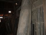 a pile of pipes in a building with a pink sticker on it