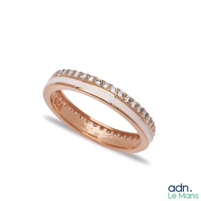 a close up of a wedding ring with diamonds on a white background
