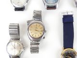 a lot of watches that are sitting on a table