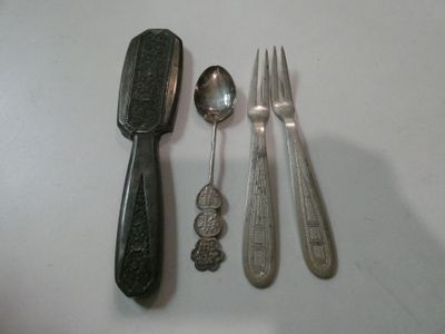 several spoons, forks and spoon rest on a white surface