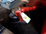 a red fire hydrant sitting on top of a black table