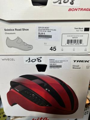 two boxes of bike helmets on display in a store