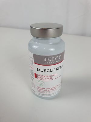 a bottle of muscle relief sitting on a table