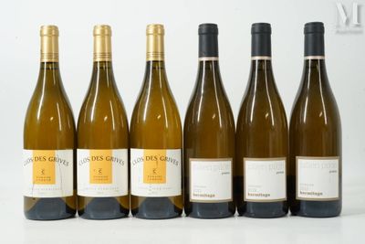 six bottles of wine are lined up in a row on a table