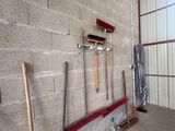a lot of tools that are on the wall of a building