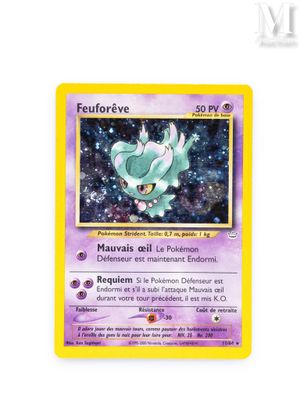 a close up of a pokemon card on a white surface