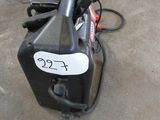 an image of a portable air compressor in a garage