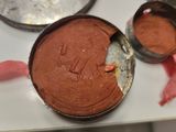 a cake that is sitting on a table with other pans