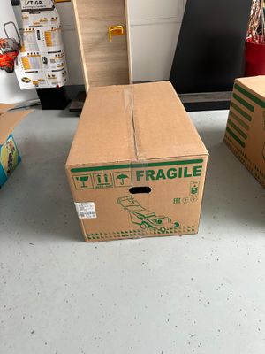 two boxes sitting on the floor next to each other