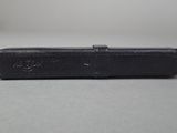 a black case sitting on a table with a white background