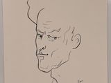 an ink drawing of a man ' s face on a piece of paper