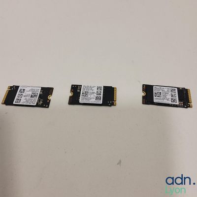 a close up of three memory modules on a white surface