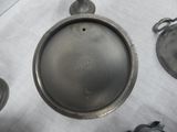 a metal pan sitting on top of a table next to other items