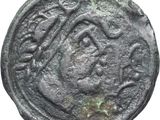 une pièce de monnaie ancienne sur laquelle figurent un cheval et un cavalier
