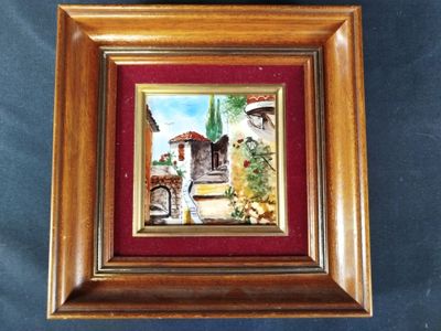 framed picture of a painting of a courtyard with a fountain